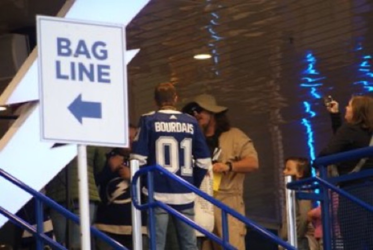 "May I See Your Ticket, Sir?" Sebastien Bourdais surprised Tampa Bay Lightning fans as they entered the arena for Saturday night's game vs. the Anaheim Ducks. Photo by Dylan Spaulding.